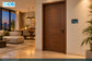 Illustrative full-room installation with the compact wall panel beside a doorway.