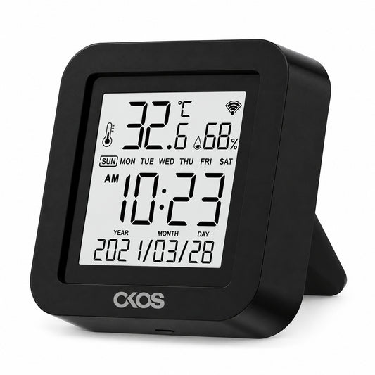 OKOS black tabletop Wi-Fi IR controller with temperature, humidity, clock and date display.